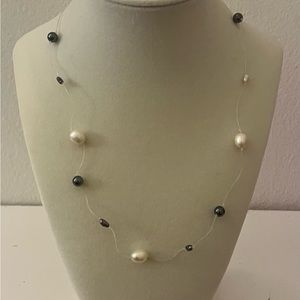 Floating pearl necklace